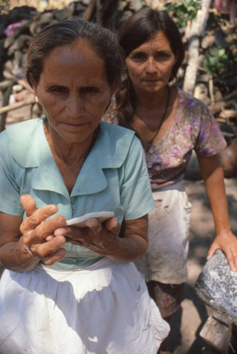 Refugees preparing tortillas at a camp near Suchitoto, Cuscatlán, El Salvador, 1981