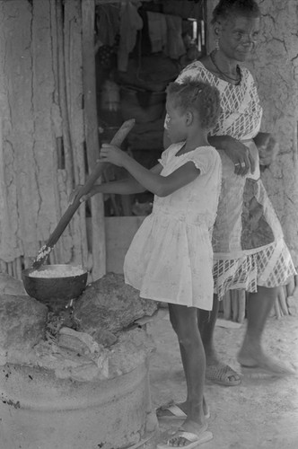 Girl stirring a pot, San Basilio de Palenque, ca. 1978