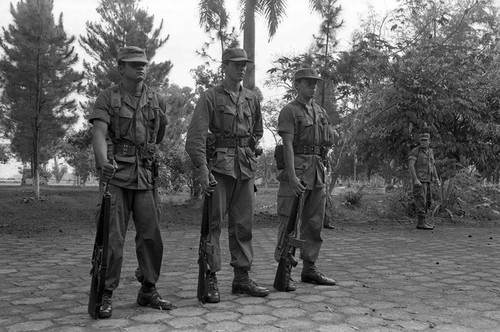 Three soldiers training at air base, Ilopango, 1983