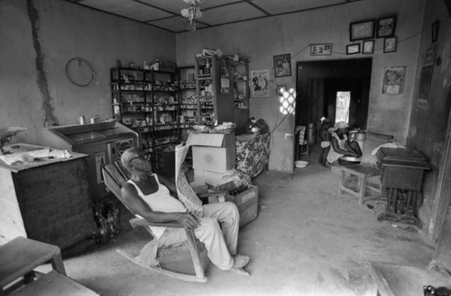 Fermín Herrera reads the newspaper, San Basilio de Palenque, Colombia, 1977