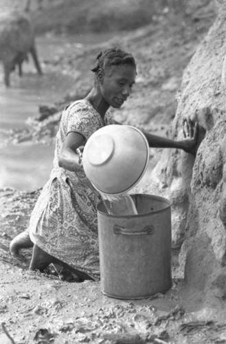 Woman collecting water, San Basilio de Palenque, Colombia, 1977