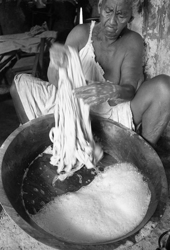 Woman washing clothes, San Basilio de Palenque, 1977