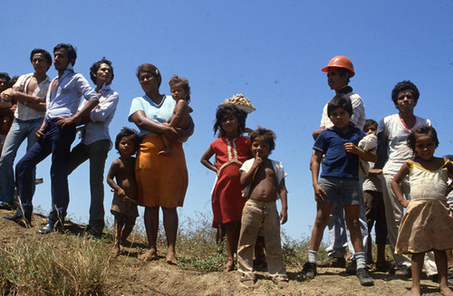 Watching a funeral procession, Nicaragua, 1983