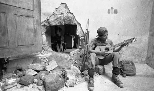 Sandinista plays guitar, Nicaragua, 1979