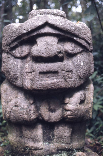 Stone statue, figure holding a snake, San Agustín, Colombia, 1975