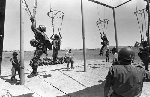 Salvadoran soldiers conduct parachuting exercises at Ilopango Military Base, Ilopango, 1983