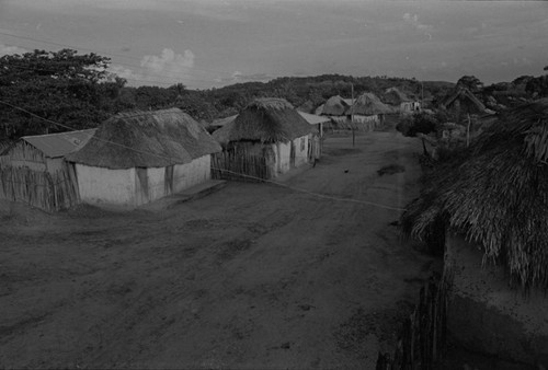 Electric poles standing in the street, San Basilio de Palenque, 1976