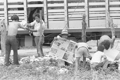 Wrapping clay pieces, La Chamba, Colombia, 1975