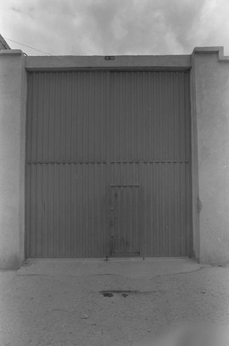 A large gate and a high wall, Tunjuelito, Colombia, 1977