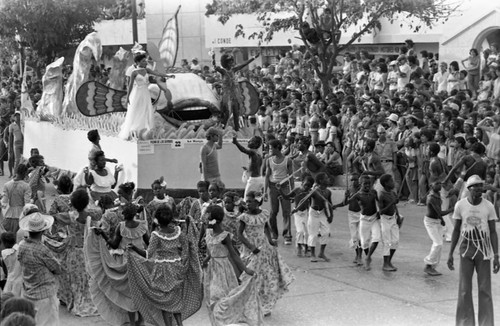 Carnival float moving through the street, Barranquilla, Colombia, 1977