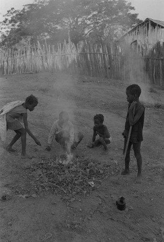 Children playing with a small fire in the street, San Basilio de Palenque, ca. 1978