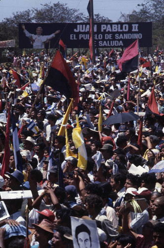 Large crowd celebrates with Pope John Paul II poster, Managua, Nicaragua, 1983