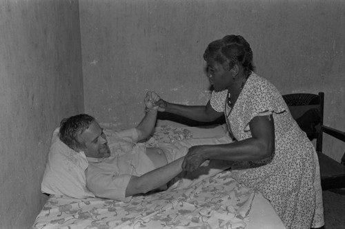 Woman giving a massage to a visitor, San Basilio de Palenque, ca. 1978