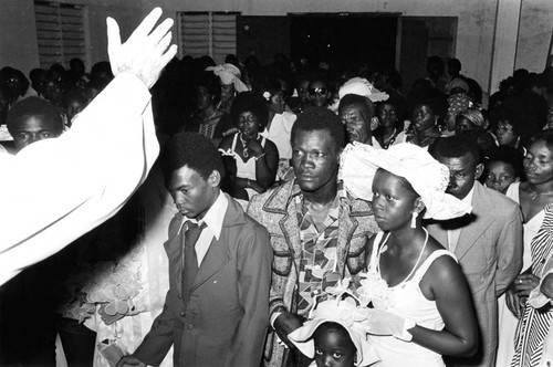 Wedding couples standing inside church during ceremony, San Basilio del Palenque, ca. 1978