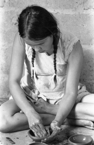 Woman crafting a clay bowl, La Chamba, Colombia, 1975