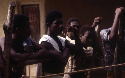 Men standing behind boxing ring, San Basilio de Palenque, 1976