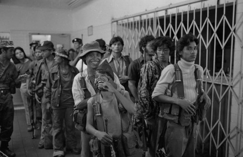 Sandinistas line-up at a hotel, Managua, 1979