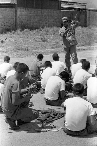 U.S. military advisor training Salvadoran soldiers, Ilopango, 1983
