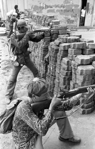 Sandinistas behind a barricade, Nicaragua, 1979