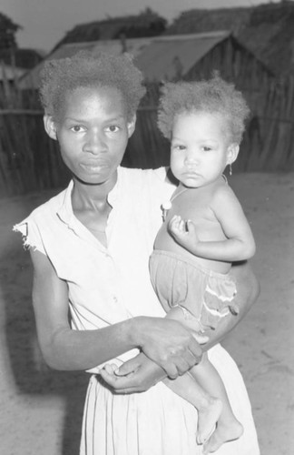 Woman holding a baby, San Basilio de Palenque, 1976