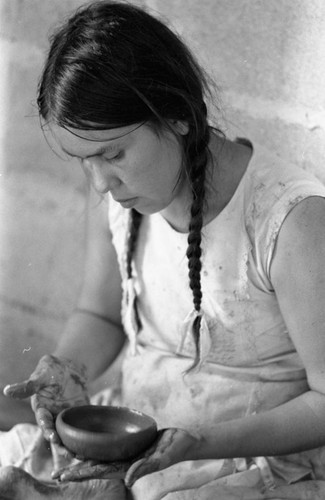 Woman crafting a clay bowl, La Chamba, Colombia, 1975