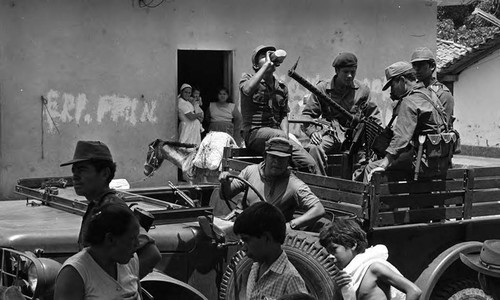 Soldiers on patrol in town, Morazán, 1983