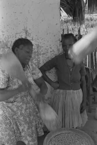 Woman grinding corn, San Basilio de Palenque, ca. 1978