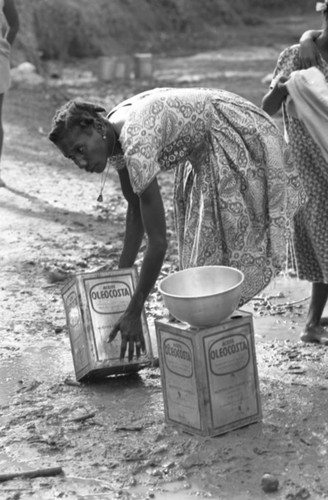 Woman collecting water, San Basilio de Palenque, Colombia, 1977