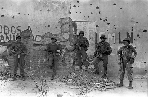 Army soldiers in front of ruins, Perquín, 1983