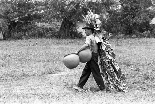 Transporting clay goods, La Chamba, Colombia, 1975