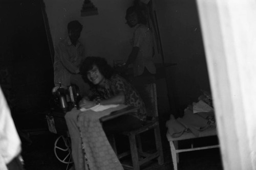 Man operating a sewing machine, La Chamba, Colombia, 1975