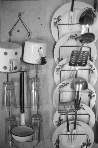 Kitchen utensils hanging from a wall, San Basilio de Palenque, 1976