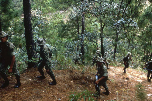 Eight armed soldiers on patrol, Guatemala, 1982