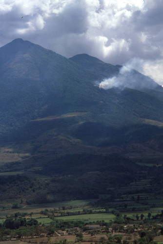 Distant view of fighting in the mountains, Cabañas, El Salvador, 1982