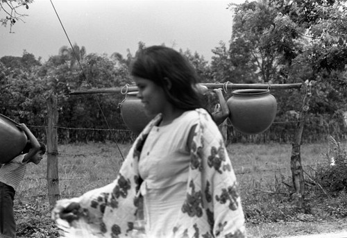 Transporting clay goods, La Chamba, Colombia, 1975