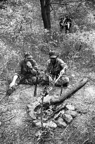 Survival school students roast a rabbit, Liberal, 1982