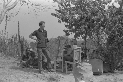 Nina S. de Friedemann, Richard Cross and others resting in the shade, San Basilio de Palenque, ca. 1978