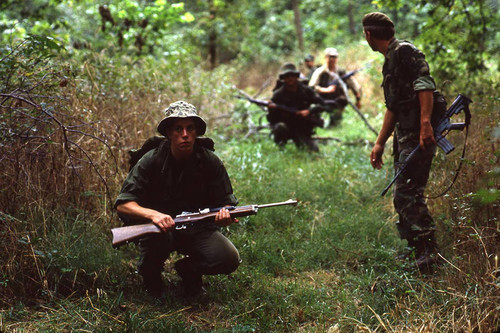 Survival school students participate in an obstacle course, Liberal, 1982