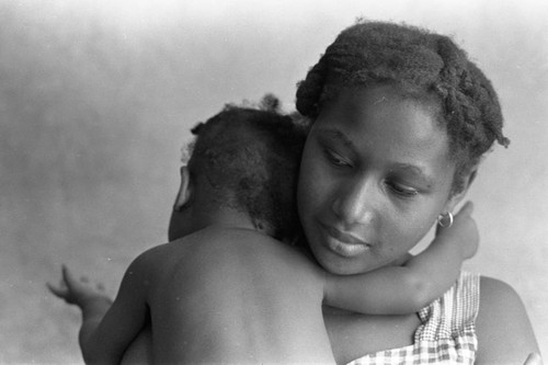 Woman holding a baby, San Basilio de Palenque, 1976