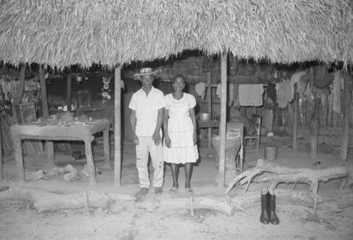 Couple standing under a porch, San Basilio de Palenque, 1976