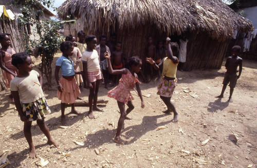 Girls boxing outdoors, San Basilio de Palenque, 1976