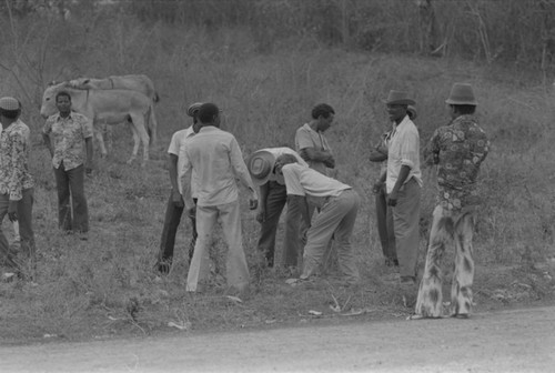 Men in conversation near cemetery, San Basilio de Palenque, Colombia, 1977