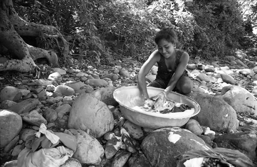 Woman washing near river, La Guajira, Colombia, 1976