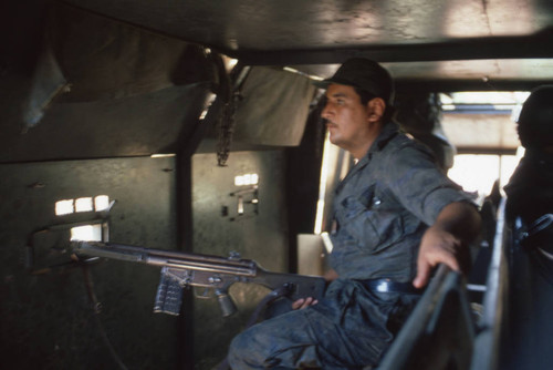 Soldiers traveling on an Armored Personnel Carrier near Suchitoto, Cuscatlán, El Salvador, 1981