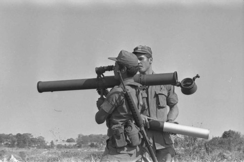 A U.S. military advisor training a Salvadoran soldier at Ilopango Military Base, Ilopango, 1983