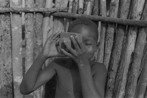 Boy playing with a toy camera, San Basilio de Palenque, 1977