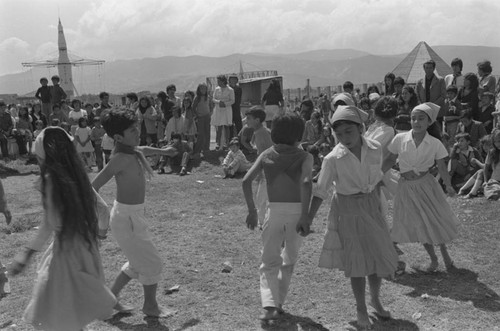 Children dancing at Tunjuelito's Christmas festivities, Tunjuelito, Colombia, 1977