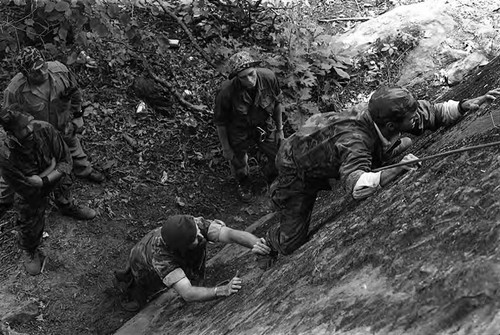 Survival school students learn to rock climb, Liberal, 1982