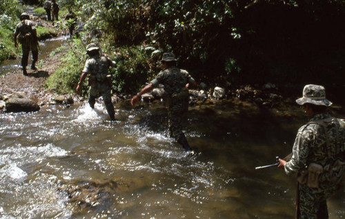 Armed soldiers crossing a river, Zaragoza, 1982