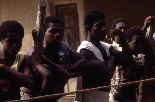 Men standing behind boxing ring, San Basilio de Palenque, 1976